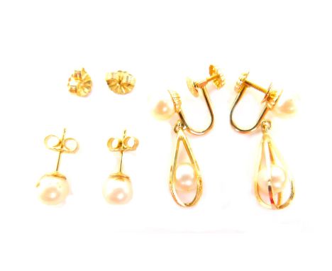 Two pairs of cultured pearl earrings, comprising a pair of stud earrings, marked 14kt, and a pair of bird cage pearl drop ear
