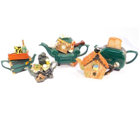 Five collector's teapots, by Cardew, Swineside and The Pottery, comprising a toaster, teapot auctioneer, travel trunk, woodma