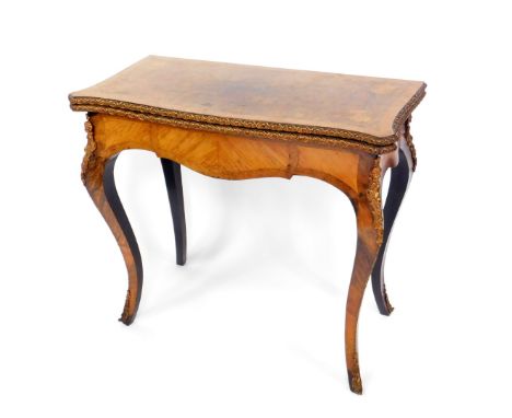 A Louis XV style Kingwood walnut and inlaid serpentine foldover card table, with metal mounts, the top inlaid with flowers, r