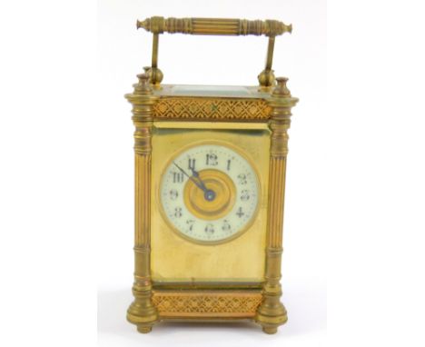 A Victorian brass carriage clock, with enamel chapter ring bearing Arabic numerals, the case with fluted columns, with key, 1