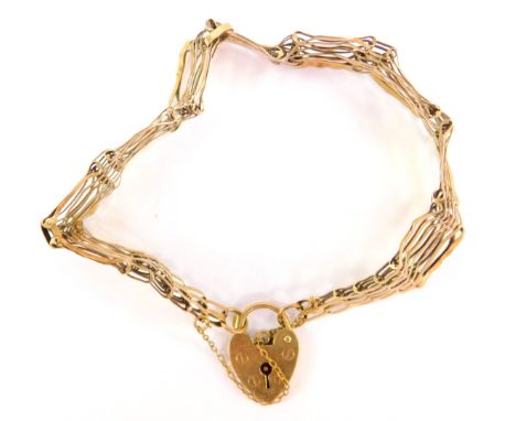 A 9ct gold gate bracelet, of eight bar design, with safety chain and padlock, 11.8g. (AF)