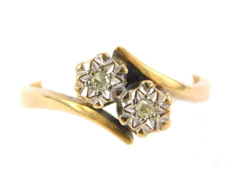 A 9ct gold and diamond two stone ring, illusion set in a crossover setting, size M, 3.0g.