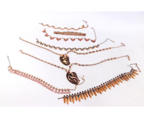 Copper brass style stone set or enamel decorated necklaces, to include examples marked M O Matise, abstract pendants, etc. (1