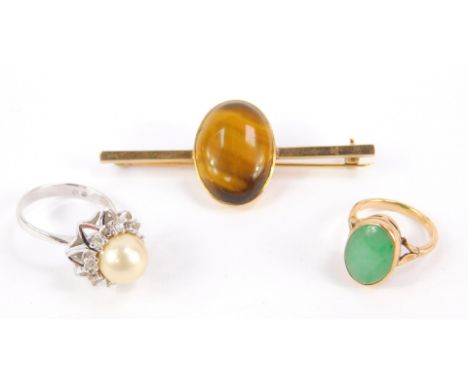 A cabachon tigers eye brooch, set in yellow metal, a green agate set ring, in yellow metal, size I, 12.5g, and a simulated pe