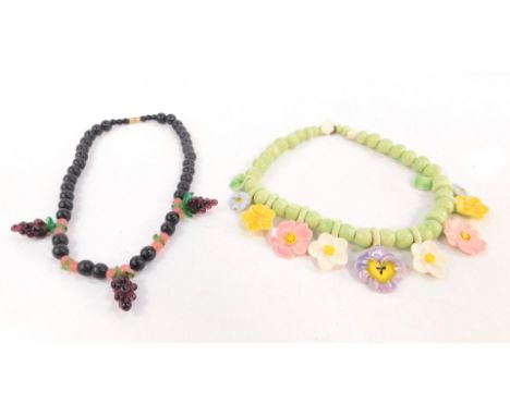 Two 1960's - 70's style necklaces, comprising a ceramic floral necklace, with varying coloured pansies, and a beaded necklace