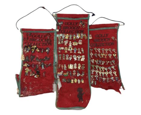 Golly Brooch Collection, a quantity of enamel brooches on red felt banners, some a/f