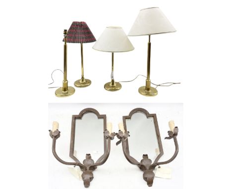 Two pairs of gilt brass table lamps with three shades, H53cm max, together with a pair of cast iron mirror backed two light g