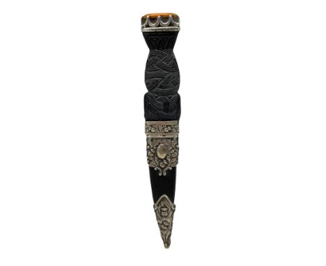 Scottish Sgean Dhu, carved knot work grip and amber glass set pommels, in silver-plated mounts and leather scabbard, stamped 