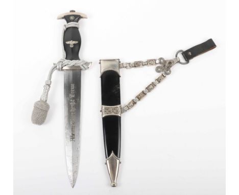 Third Reich SS Officers Chained Dress Dagger, with grip retaining enamel SS runes and eagle. Housed in the scabbard with set 