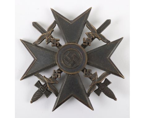 Luftwaffe Spanish Cross with Swords by C E Juncker, bronze grade example with pin and catch fixing. Early CEJ makers mark in 