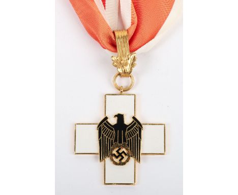German Third Reich Type Red Cross (D.R.K) Neck Order Award, gilt and enamel example with black eagle with swastika to the cen
