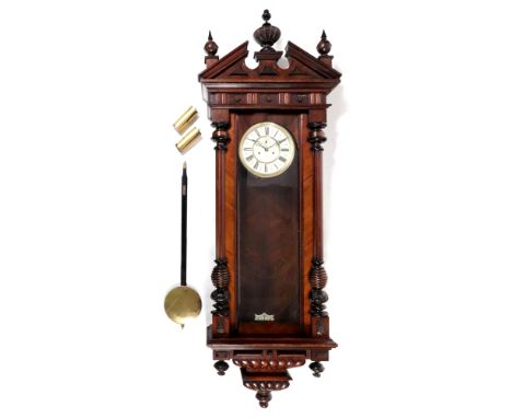 A Vienna regulator style wall clock, late 19th century, the walnut and ebonised architectural style case with a broken pedime