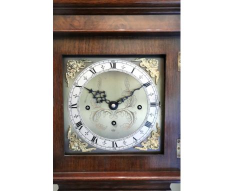 An Elliott clock mahogany and figured walnut grandmother clock, in late 17th century style, the caddy top with cast brass fin