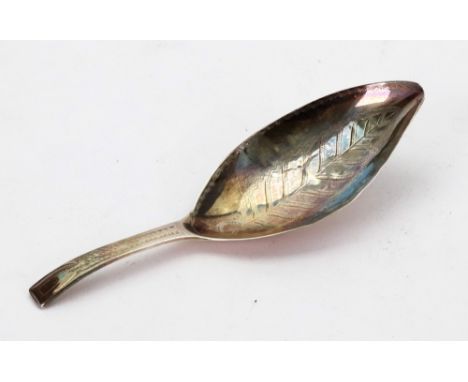 A George III silver caddy spoon, John Wren, London 1797, bright cut engraved, with narrow curved rectangular handle and leaf 