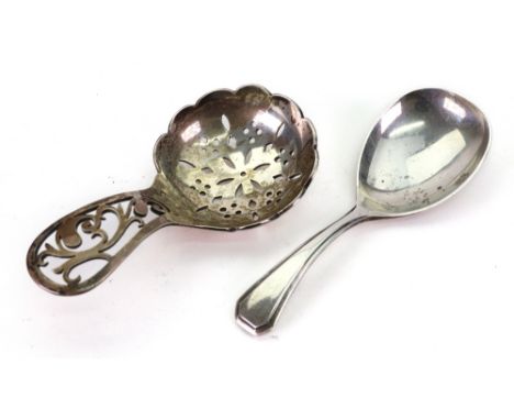 A silver caddy spoon, Robert Pringle, London 1946, with scroll pierced handle and pierced lobed sided circular bowl, 8cm long