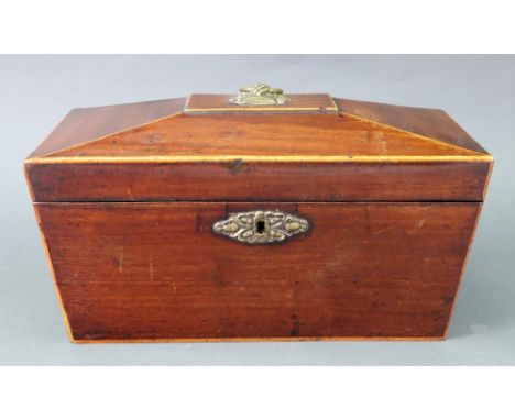 A Regency mahogany boxwood banded sarcophagus shape tea caddy, the hinged cover enclosing two compartments and a recess, 28cm