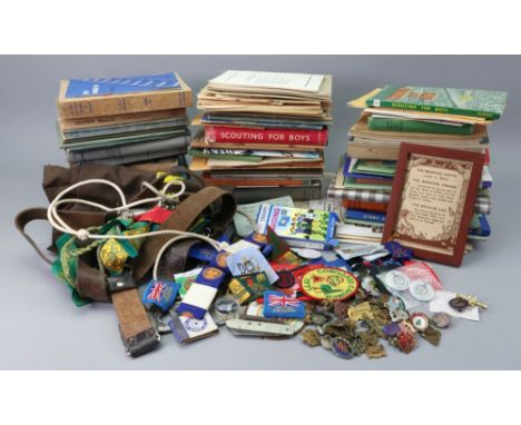 A large collection of Scouts and Girl Guides ephemera including badges, belt, whistle and compass, pocket knife, cloth badges