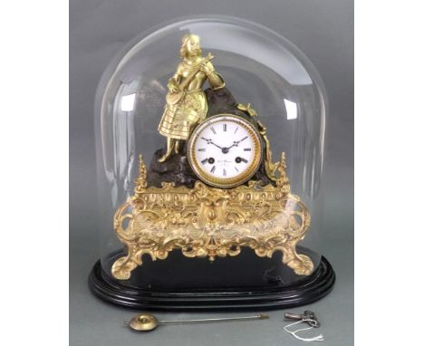 Henry Marc a Paris; a gilt metal and bronzed mantel clock, second half 19th century, the dial within rockwork surmounted by a