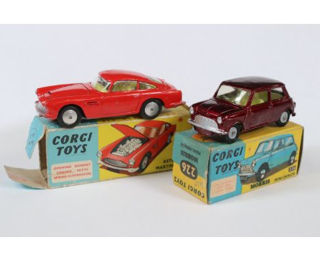 Two boxed Corgi diecast models to include 226 Morris Mini-Minor in metallic maroon and 218 Aston Martin DB4 in red (Missing e