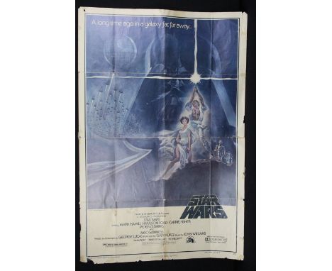 Original 1977 Star Wars - A New Hope US One Sheet 'Style A' film poster, showing signs of wear and ripping throughout, measur