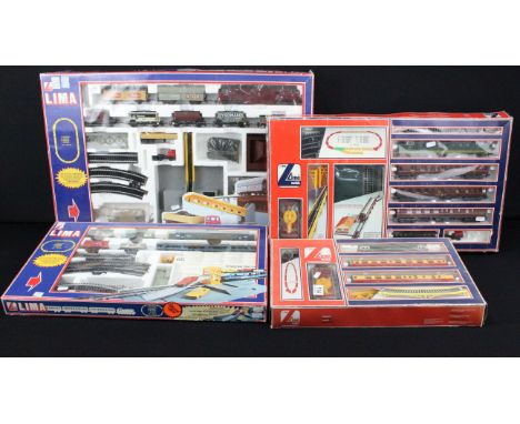 Four boxed Lima OO gauge train sets to include 101306AW with Meld locomotive, 106207 with Royal Scot Grey locomotive, 106006A