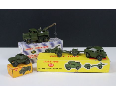Three boxed Dinky military diecast models to include 697 25-Pounder Field Gun Set, 673 Scout Car and 661 Supertoys Recovery T