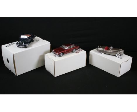 Three boxed 1/24 Danbury Mint Classic Cars diecast models to include The 1949 Jaguar XK120 Roadster in grey, 1936 Ford Deluxe