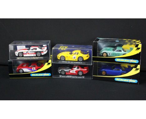 Six boxed / cased slot cars to include 3 x Scalextric (C2363 TVR Speed 12 Collectors Cub 2001, C2247 TVR Green and TVR Mobil 