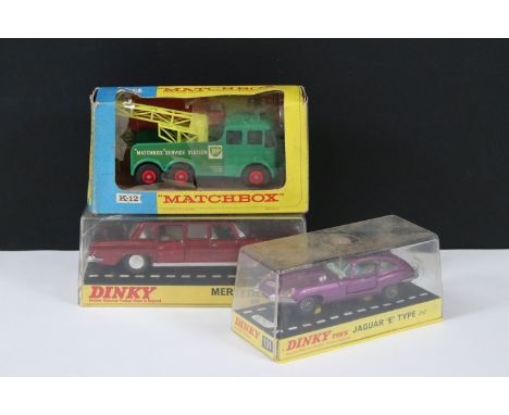 Two cased Dinky diecast models to include 131 Jaguar E Type 2+2 in purple and 128 Mercedes Benz 600 in metallic dark red (cra