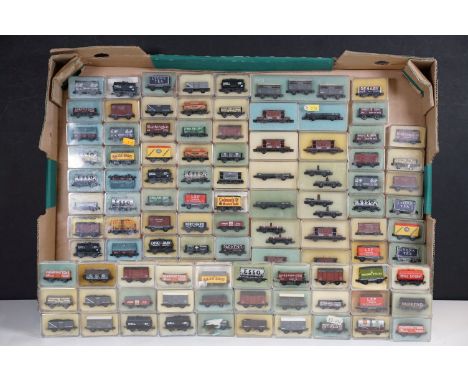 Around 110 cased Peco N gauge items of rolling stock to include wagons, vans and tankers featuring Colmans, Lyons, ESSO, SAXA