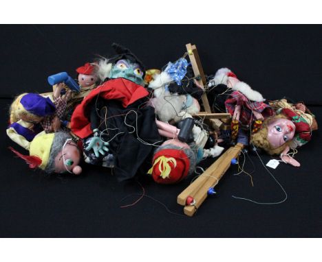Around 16 Pelham Puppets to include Rupert the Bear, Witch, Green Witch etc, all strings tangled