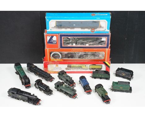 Four boxed OO gauge locomotives to include 2 x Hornby (R264 BR Class 9F 2-10-0 and R845 LNER Flying Scotsman), Lima King Geor