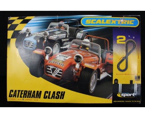 Boxed Scalextric Sport C1125 Caterham Clash set, appearing complete with 4 x slot cars