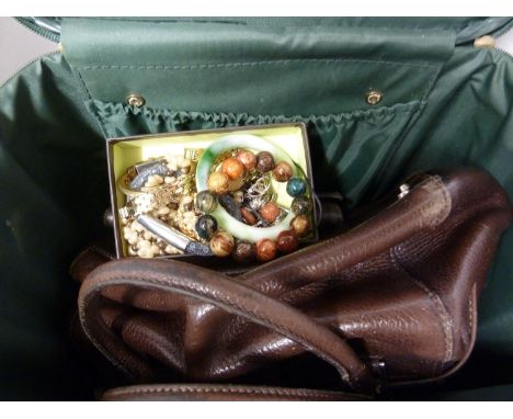 A quantity of costume jewellery, a jade glass bangle; a mulberry ladies purse; a Nicole Farhi handbag and a vanity case (qty)