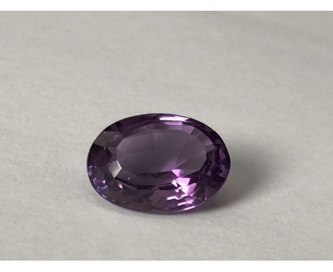 A natural amethyst stone, unmounted, oval, 11.7 ct (2) 