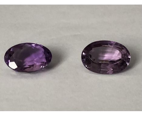 Two natural amethyst stones, unmounted, oval, 12.03 ct and 12.69 ct (2) 