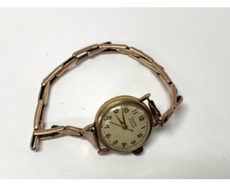 A 9ct gold cased ladies Rotary wristwatch on a 9ct gold on silver expanding strap. 16.4g (A)