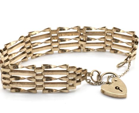 A 9ct gold gate bangle, total weight 11g. Postage category a