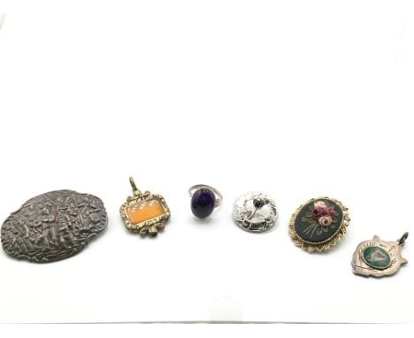 A silver brooch, a ring and other oddments