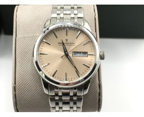 A Dreyfuss and co day date watch with box and papers. Seen running. Excellent condition. 40mm case including crown.