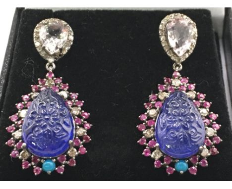 A pair of large drop earrings set with pear shaped carved tanzanites, turquoise, morganites, rubies and diamonds, stamped 14k