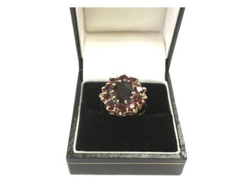 A 9ct gold and garnet cluster ring, approx 3.98g and approx size N. Shipping category A.