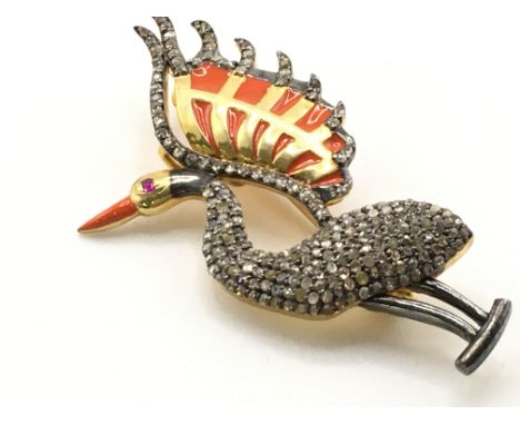 A silver gilt wading bird brooch inlaid with rich orange enamel and set with rose-cut diamonds, with a ruby eye. Diamonds 1.6