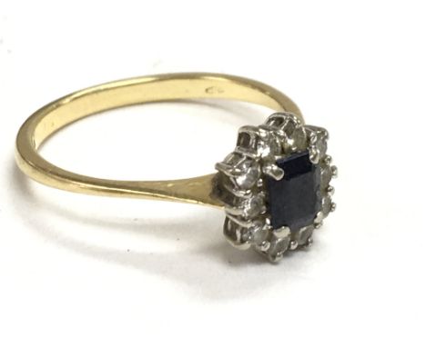 An 18 carat gold diamond and black sapphire ring, 3.3g size Q, postage category A