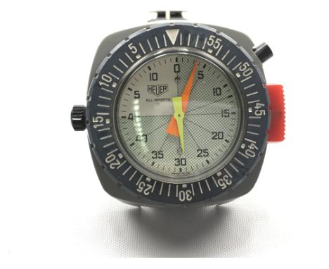 Heuer wrist timer all sports II model. 48mm case. In good condition with original Tropic strap. Seen running. Postage B