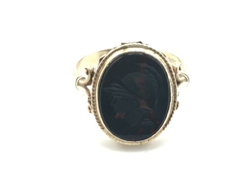 A 9ct gold ring set with Intaglio blood stone. 4.3g and size S Postage A