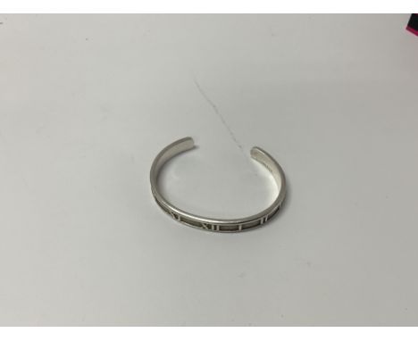 A silver tiffany & co atlas bangle.