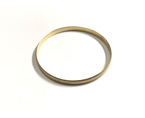 A 9ct gold bangle, approx weight 13.64grams.