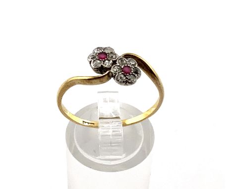 A 1930s 18ct Daisy ruby and diamond ring. (A)