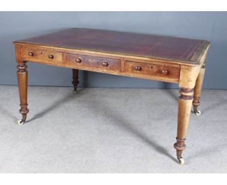 @A Victorian Partners Oak Rectangular Writing Table, with red tooled leather inset top and with moulded edges and rounded cor